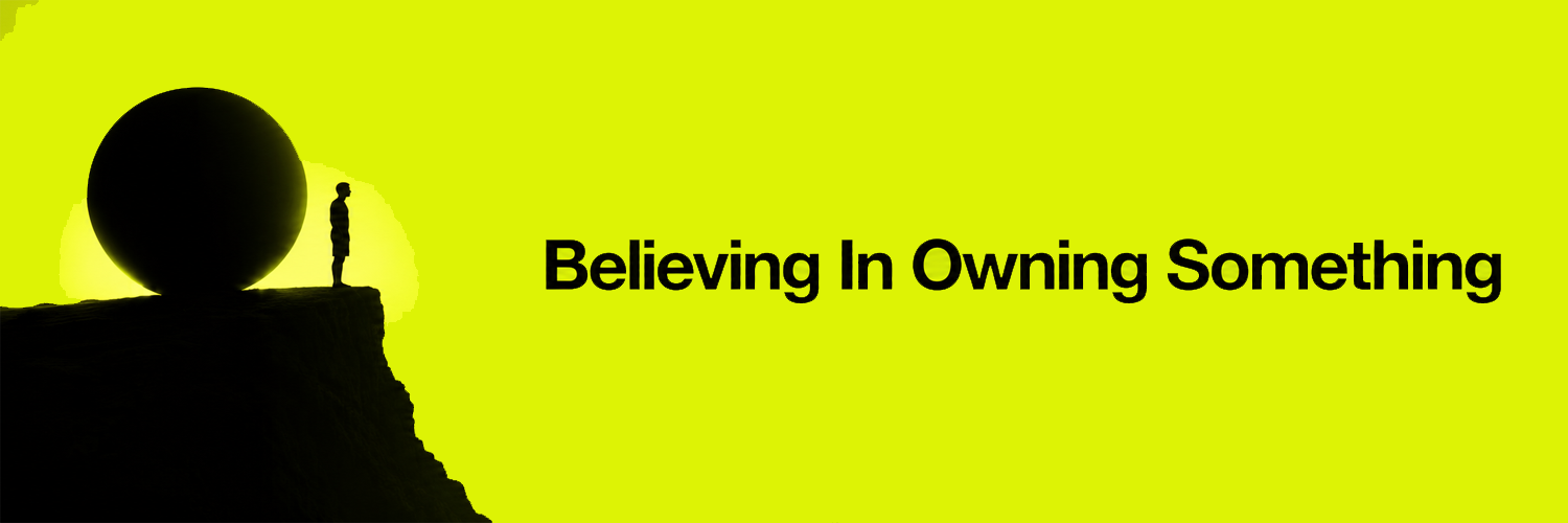 Believing In Owning Something — figure on a cliff beside a sphere